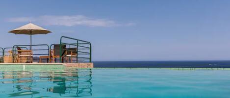 Seasonal outdoor pool, pool umbrellas, sun loungers