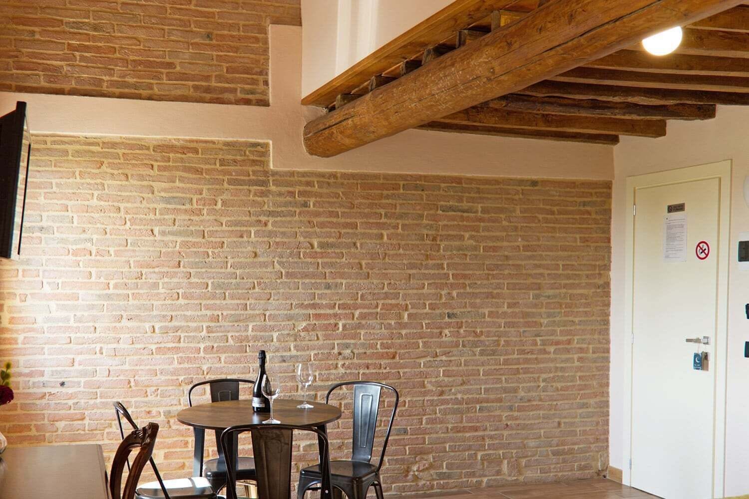 Junior Quadruple Room | Living area | Flat-screen TV