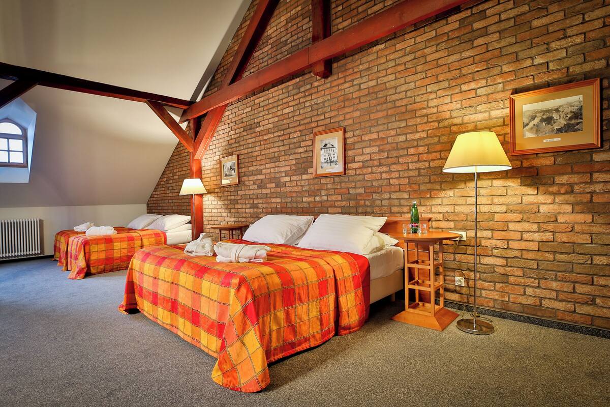 superior family room | minibar, in-room safe, desk, laptop workspace