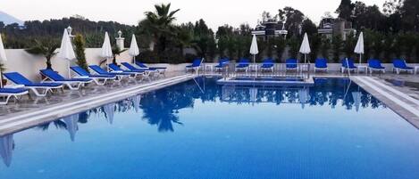 Seasonal outdoor pool, open 10 AM to 7 PM, free pool cabanas