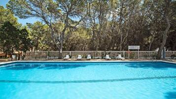 Seasonal outdoor pool, open 10:00 AM to 6:00 PM, pool umbrellas