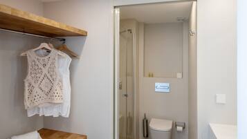 Shower, hair dryer, towels, toilet paper