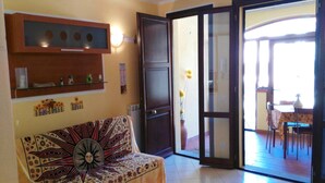 Apartemen | Area keluarga | TV layar datar