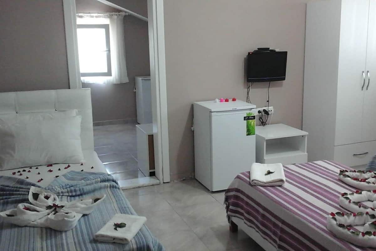 Familie appartement | Een minibar, verduisterende gordijnen, gratis wifi, beddengoed