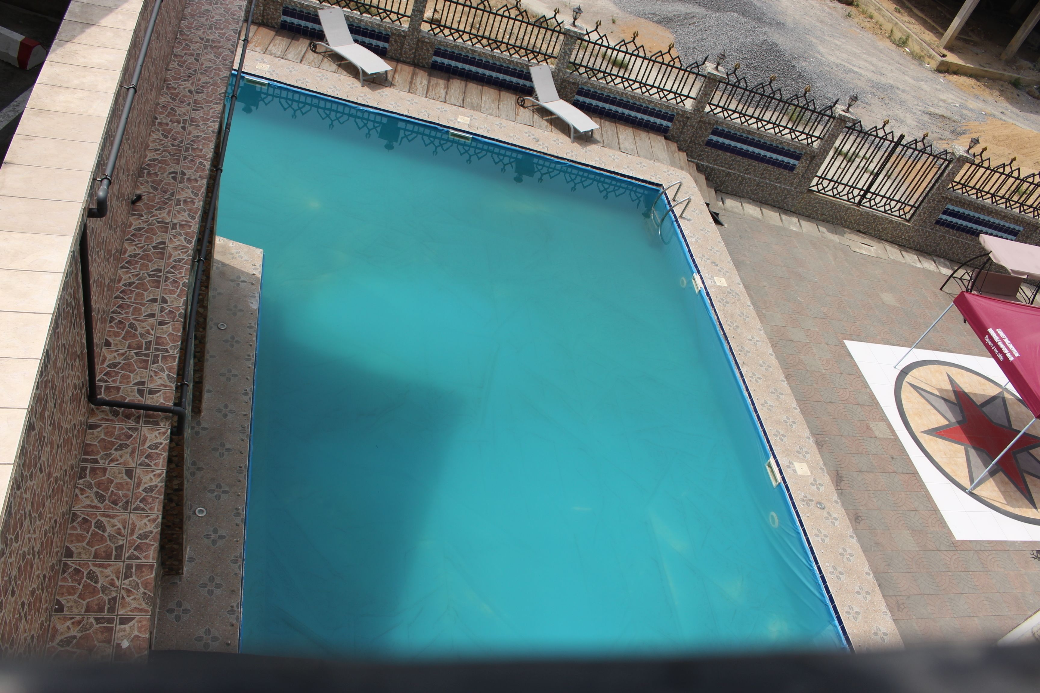 outdoor pool, pool umbrellas, pool loungers