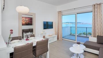 Exclusive Apartment, 2 Bedrooms (Penthouse) | Living area | Flat-screen TV