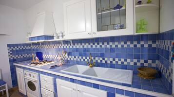 Apartment | Private kitchen | Fridge, oven, stovetop, cookware/dishes/utensils