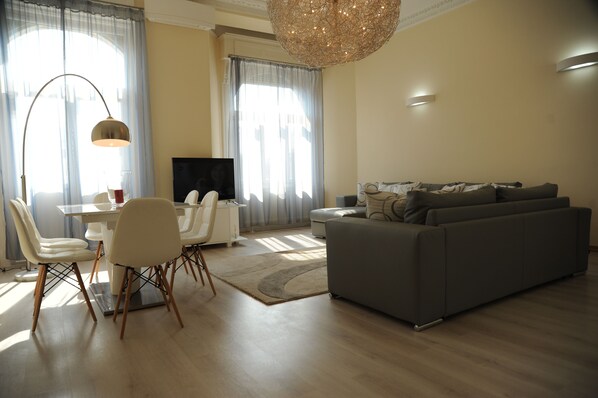 Exclusive Apartment, 1 Bedroom, City View | Living area | 50-inch flat-screen TV with digital channels, TV, DVD player