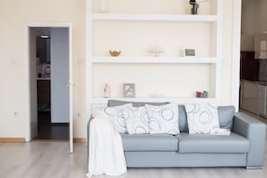 Exclusive Apartment, 1 Bedroom, City View | Living area | 50-inch flat-screen TV with digital channels, TV, DVD player