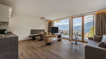 Deluxe Apartment, Patio (Panoramic) | Living room | 26-inch flat-screen TV with digital channels, TV