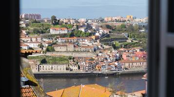 A coastal town with historic buildings and a river.