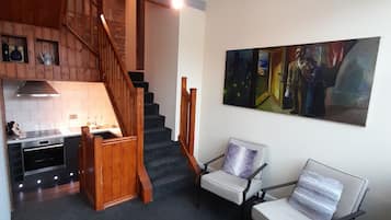 Panoramic Suite, 1 Queen Bed, Non Smoking | Living area | Flat-screen TV