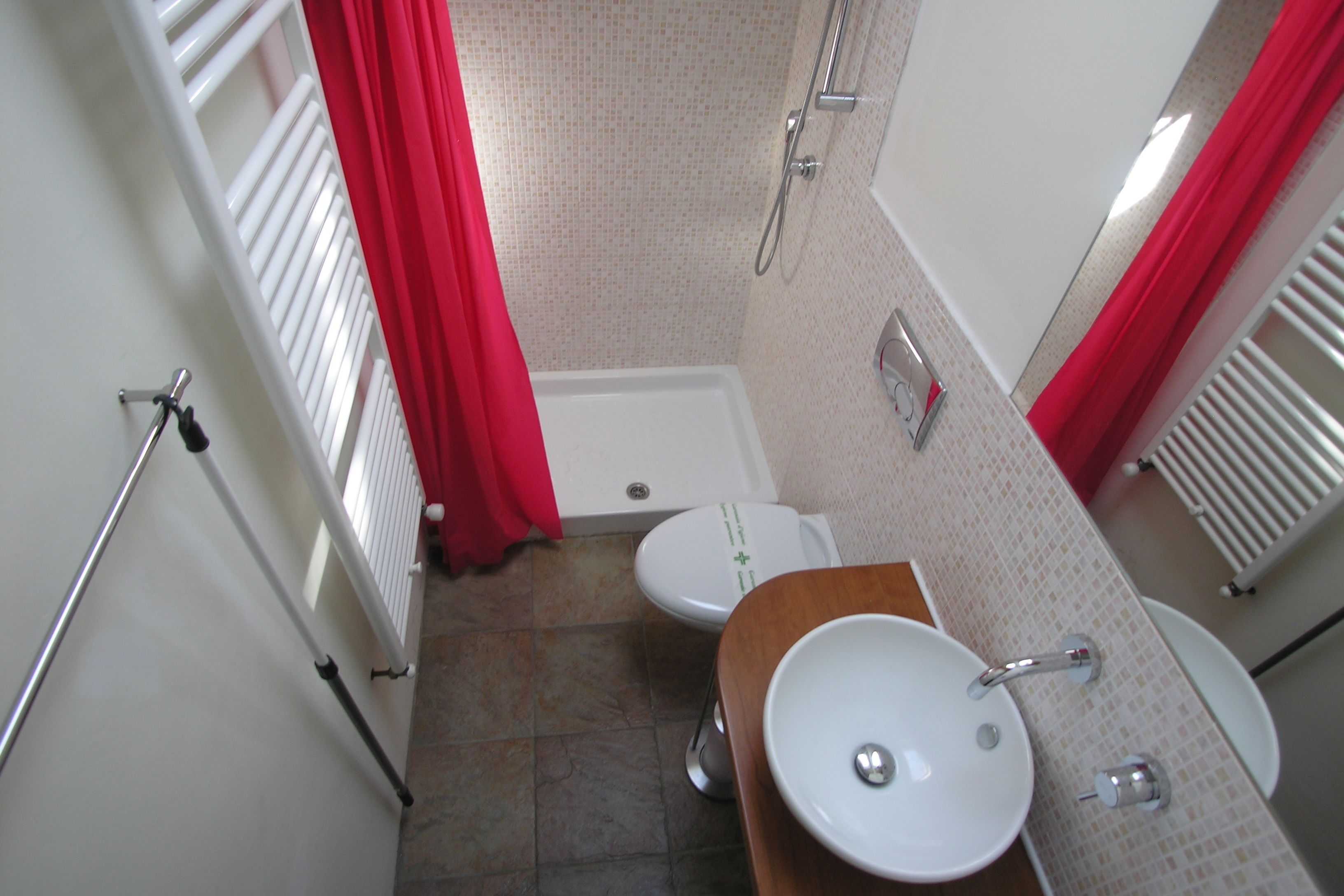 A bathroom with a bathtub, toilet, and sink.