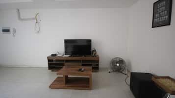 Apartamento standard, 1 quarto | Sala de estar