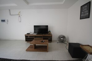Apartamento standard, 1 quarto | Sala de estar