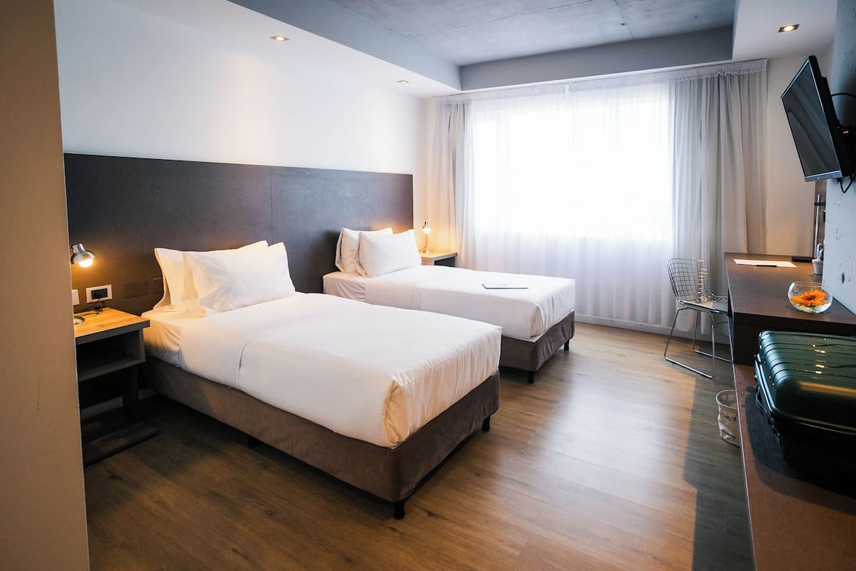 Premium bedding, down comforters, pillowtop beds, minibar