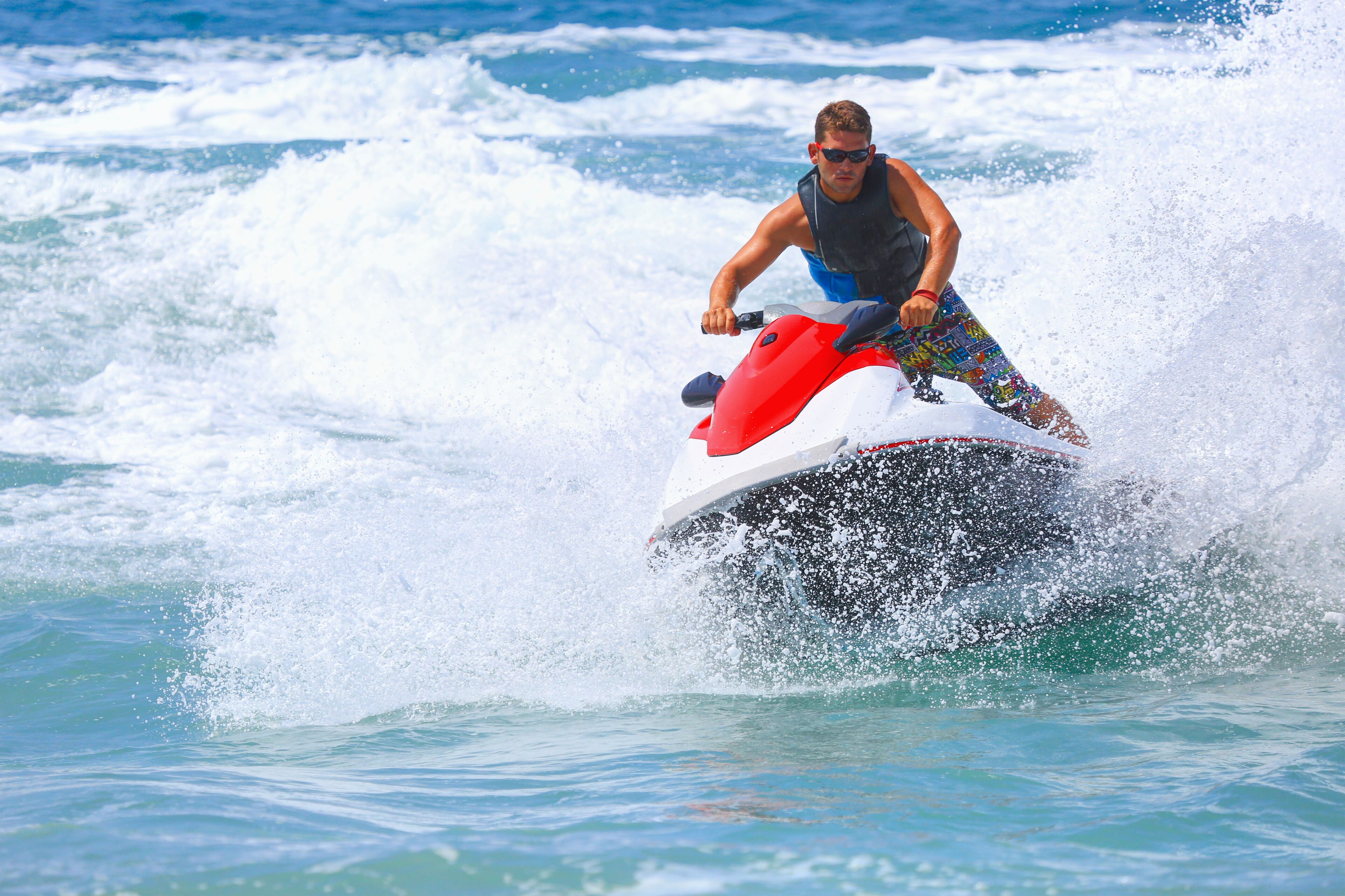 A person riding a jet ski on water.