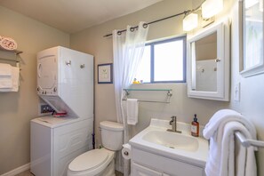 Combined shower/bathtub, hair dryer, towels, soap