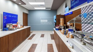 A breakfast area with a sign reading 'GOOD MORNING' and a counter with food items and a coffee machine. - Holiday Inn Express & Suites Punta Gorda by IHG (Punta Gorda)