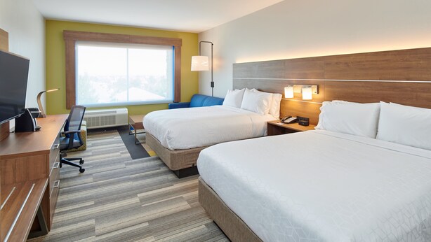 A hotel room with two beds, a desk with a computer, a TV, and a window with a view. - Holiday Inn Express & Suites El Paso East-Loop 375 by IHG (El Paso)