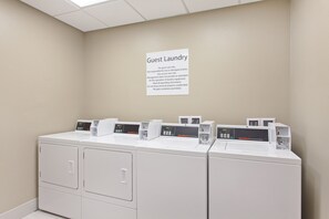 A guest laundry area with multiple washing machines and a sign indicating it is for guest use only. - Holiday Inn Express & Suites Moses Lake by IHG (Moses Lake)