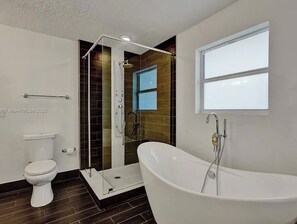 Bathtub, hair dryer, towels, soap