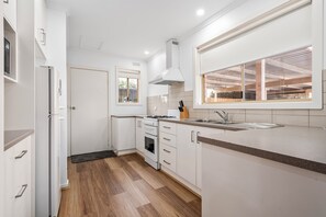 Microwave, electric kettle, dining tables