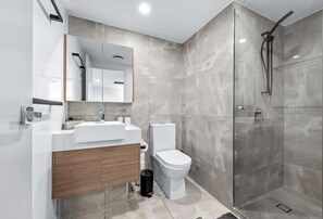 Shower, hair dryer, towels, shampoo