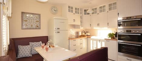Oven, freezer, dining tables