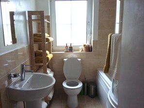 A bathroom with a sink, toilet, and a window. - Delightful cottage set in the pretty village of Clearwell, Forest of Dean.  (Clearwell)