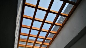 A skylight with a wooden grid design.