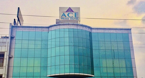 A modern hotel with a prominent sign reading "ACE PRIME HOTEL" on the top. - Ace Prime Hotel (Greater Noida)