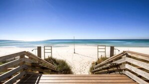 A wooden boardwalk leading to a sandy beach with a clear view of the ocean. - BOOK SUMMER NOW. GREAT RATES! Gulf-Front Master w/Balcony + PRIVATE Bunkroom (Panama City Beach)