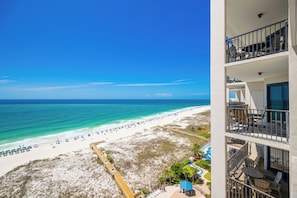 A beachfront hotel with balconies, a pool, and beach access. - Phoenix East II 2125 - 3BR Condo on the Beach! (Orange Beach)