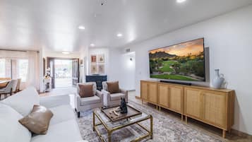 Smart TV, fireplace, books, stereo