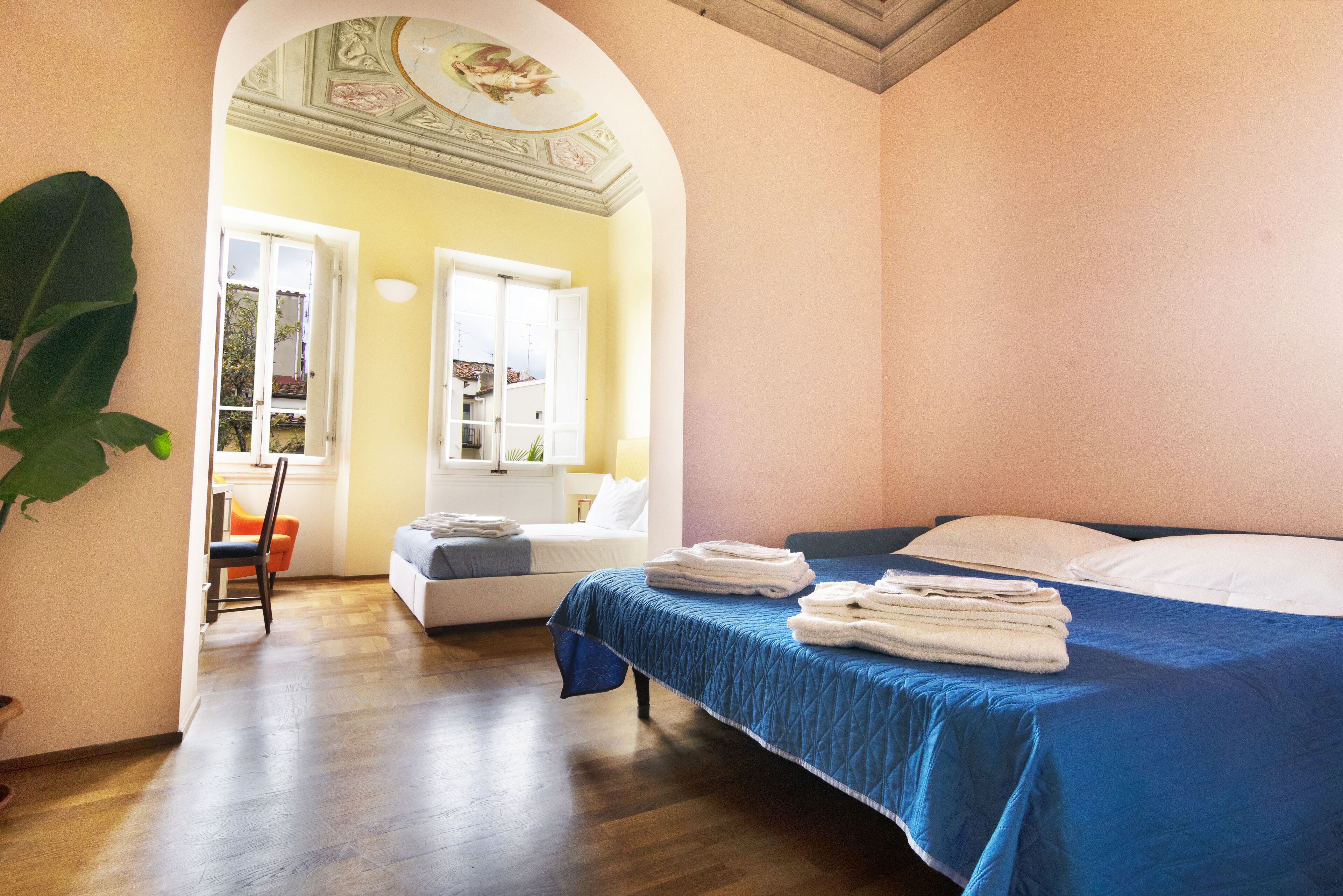 superior quadruple room, garden view | premium bedding, in-room safe, laptop workspace, free wifi