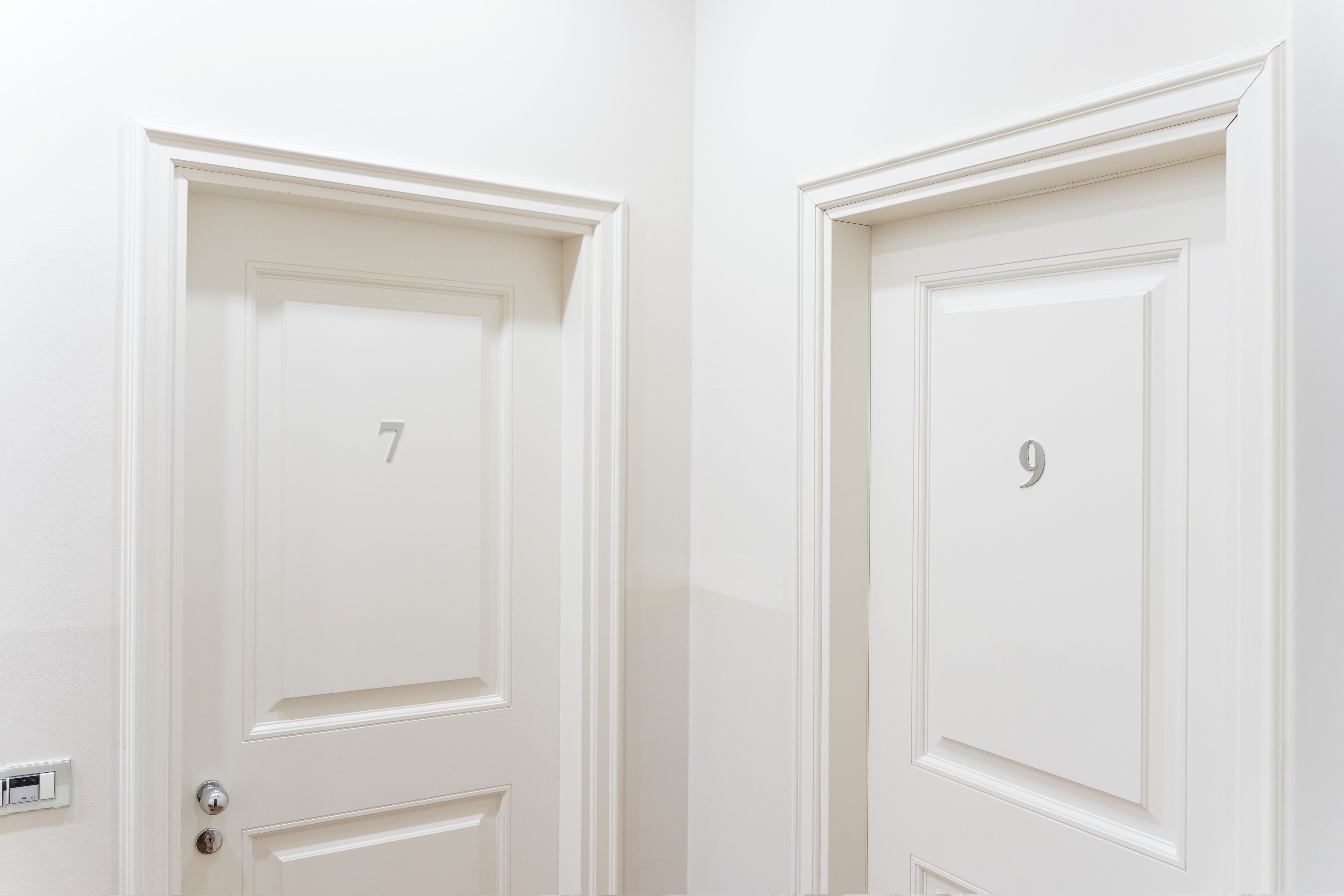Two white doors with numbers 7 and 9.
