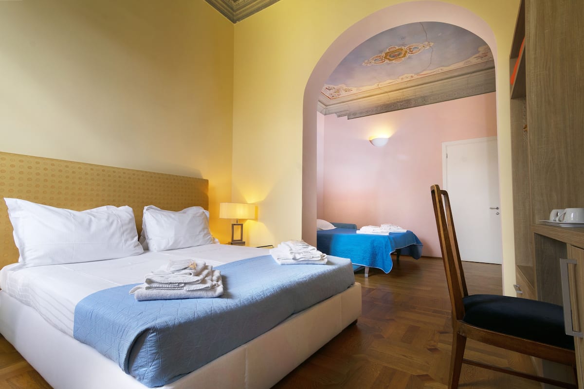 Superior Quadruple Room, Garden View | Premium bedding, in-room safe, laptop workspace, free WiFi