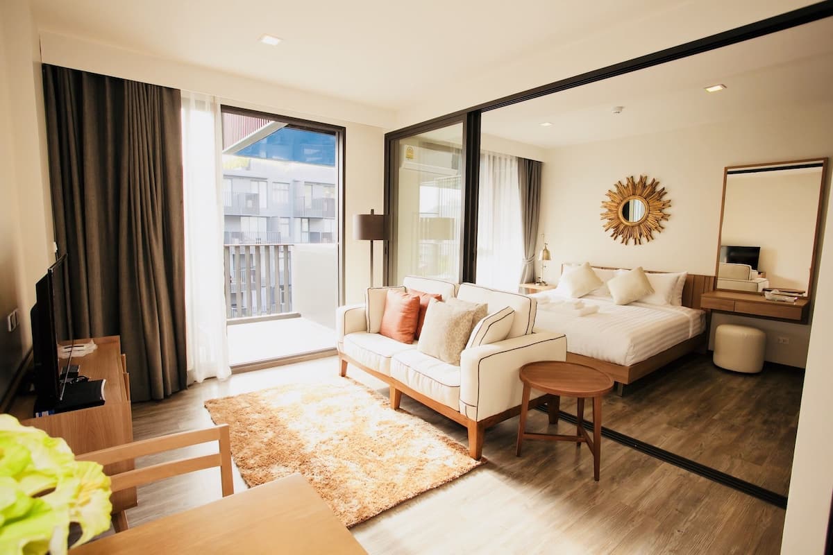 1 Bedroom Apartment | Living area | Flat-screen TV