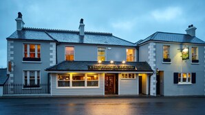 A two-story building with a sign reading "The Horse & Hound." - The Horse & Hound (Delgany)