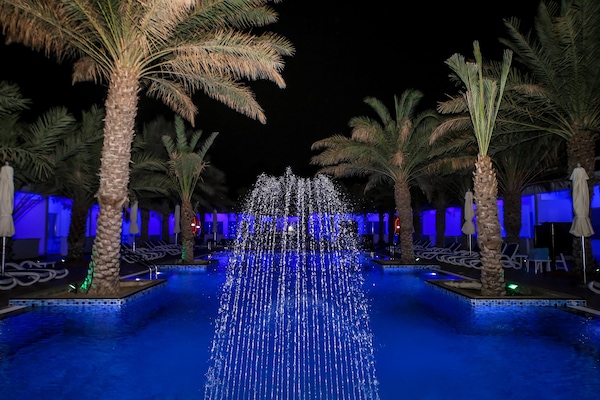 Outdoor pool, open 9:00 AM to 8 PM, pool umbrellas, sun loungers