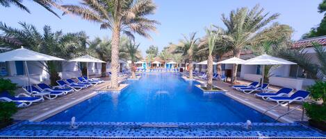 Outdoor pool, open 9:00 AM to 8 PM, pool umbrellas, pool loungers