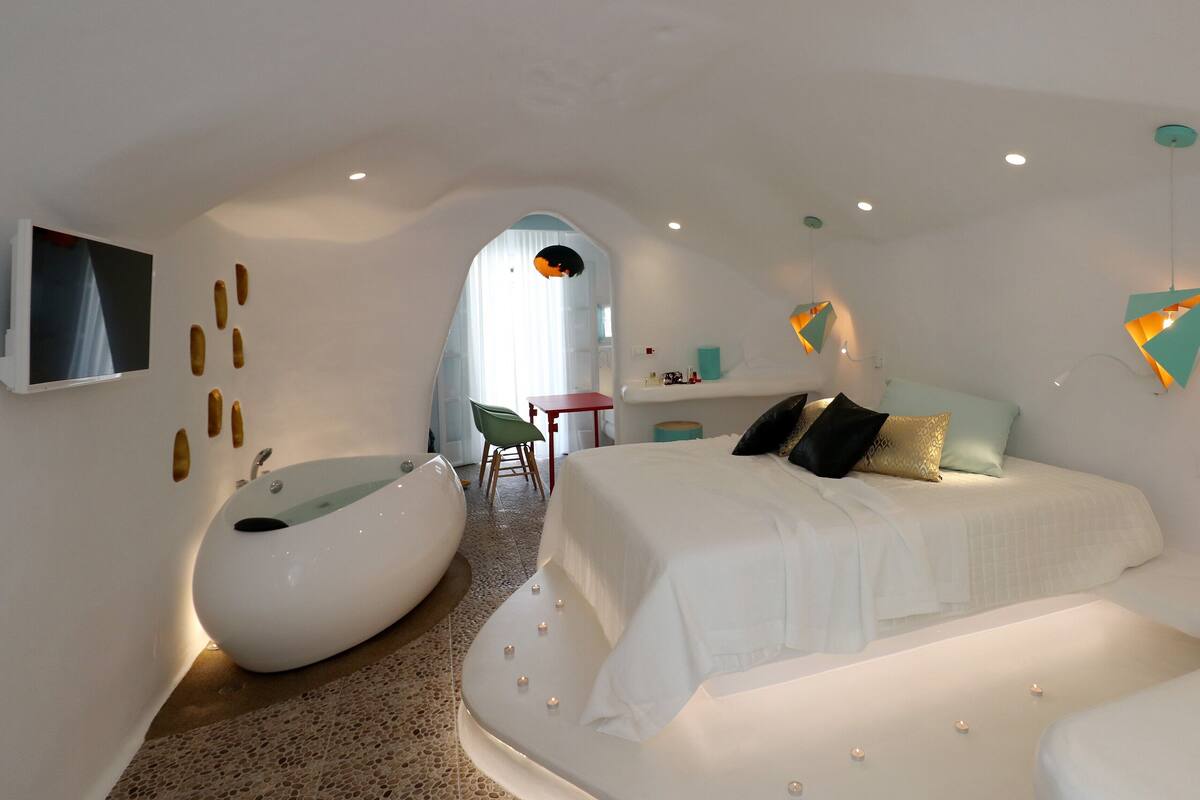 Lithos Cave Suite with hot tub | Egyptian cotton sheets, premium bedding, memory foam beds, desk