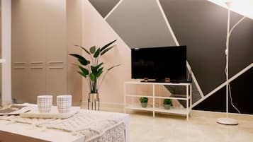 Signature Apartment, 1 Bedroom | Living room | 40-inch LED TV with digital channels, TV, streaming services