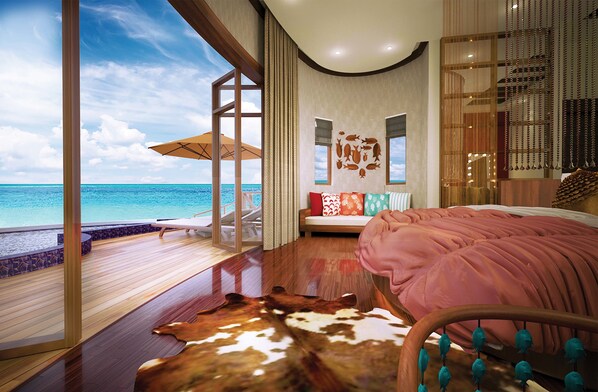 A bedroom with a large bed, a view of the ocean, a wooden floor, and a cowhide rug. - OBLU SELECT Sangeli - Premium All Inclusive with Free Transfers (Akirifushi)