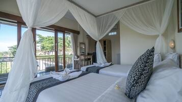 Deluxe Double or Twin Room | Minibar, in-room safe, desk, blackout drapes