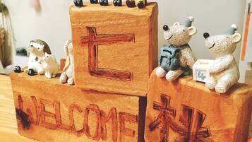 Wooden blocks with bear figurines and the word "WELCOME" on one side.