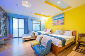 A hotel room with two beds, a dining table, and a chair. - Mushroom Bed & Breakfast (Dongshan)