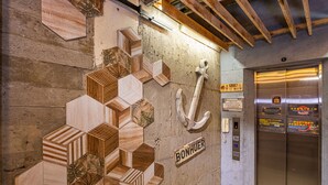 A wall with geometric wooden panels and a sign reading "BONHUER".