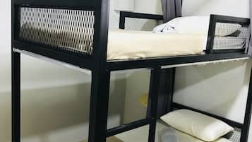 A bunk bed with a mesh headboard and a white mattress.